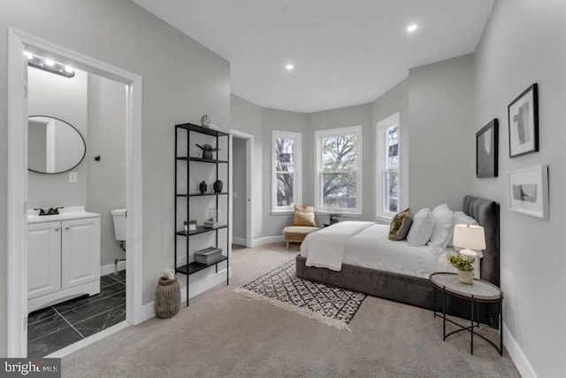 1645 Gorsuch Ave, Baltimore, MD 21218 - bedroom featuring baseboards, recessed lighting, ensuite bath, carpet floors, and a sink