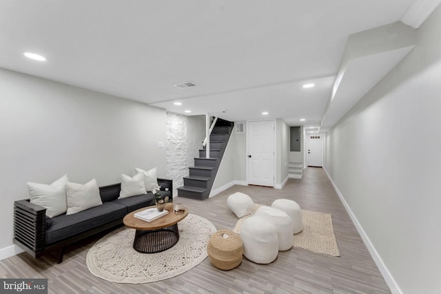1645 Gorsuch Ave, Baltimore, MD 21218 - living area with stairs, wood finished floors, baseboards, and recessed lighting