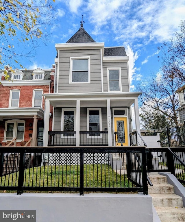 view of front of house with a front lawn and a porch