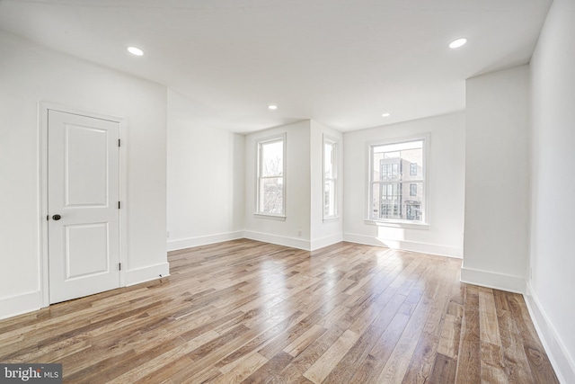 spare room featuring light hardwood / wood-style floors