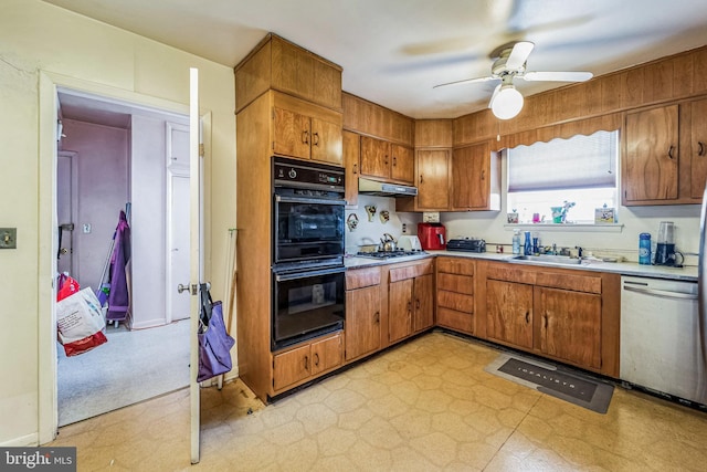 kitchen with appliances with stainless steel finishes, ceiling fan, and sink