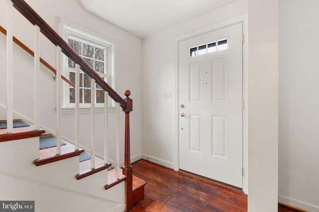 foyer with dark hardwood / wood-style flooring