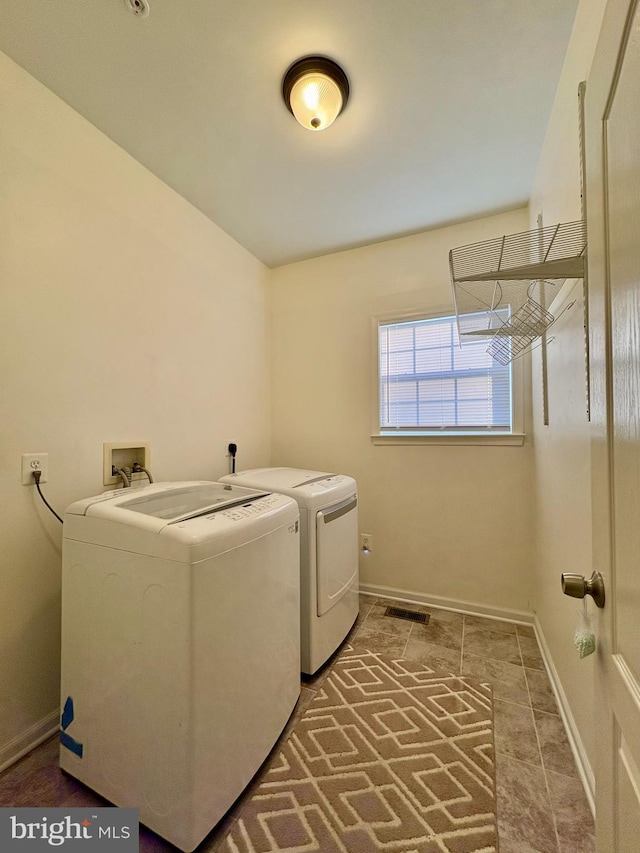 laundry area with washing machine and dryer