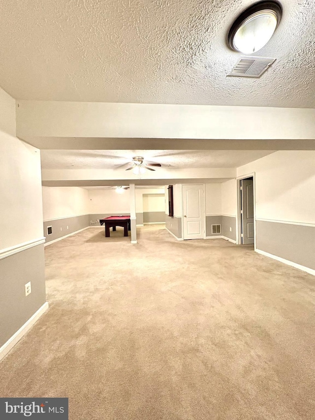 interior space with ceiling fan, carpet flooring, a textured ceiling, and billiards