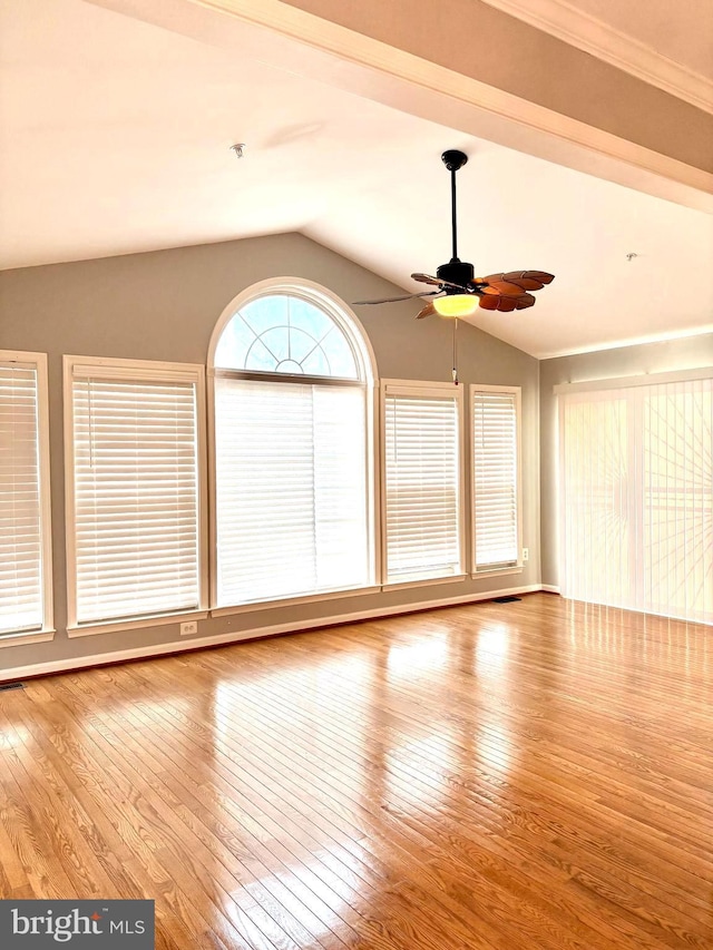 interior space with vaulted ceiling, ceiling fan, and light hardwood / wood-style floors