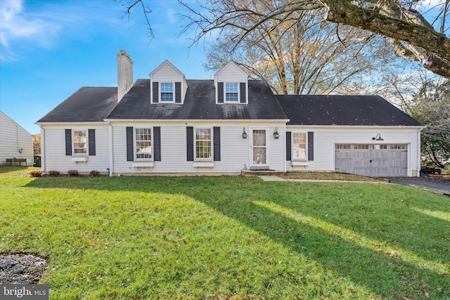 cape cod home with a garage and a front lawn