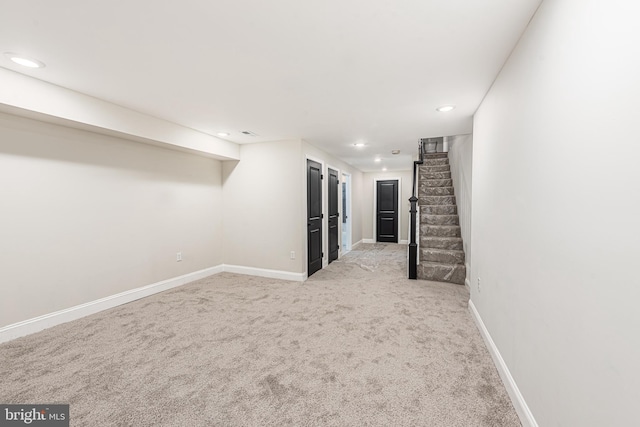 basement with light colored carpet