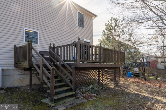 back of house featuring a wooden deck