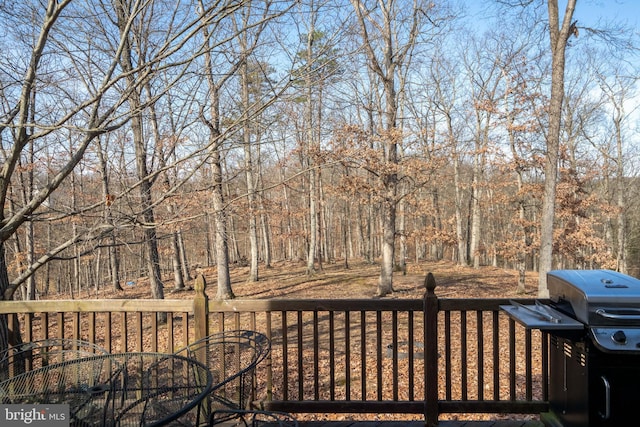 wooden deck featuring grilling area