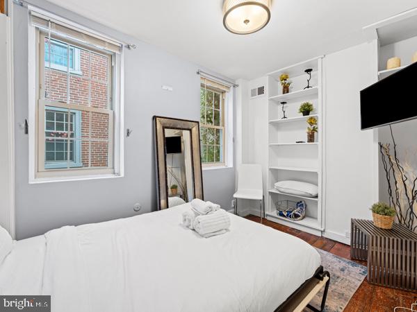 bedroom featuring dark hardwood / wood-style flooring