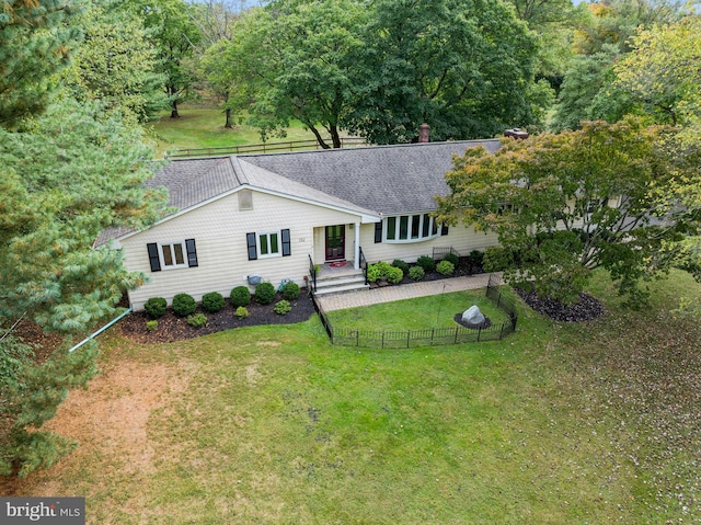 single story home featuring a patio and a front lawn