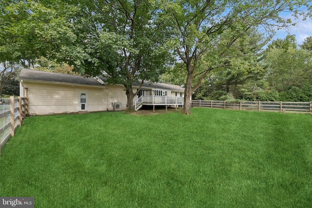 view of yard with a wooden deck