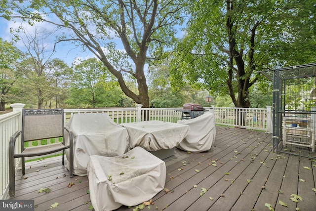 wooden deck featuring area for grilling