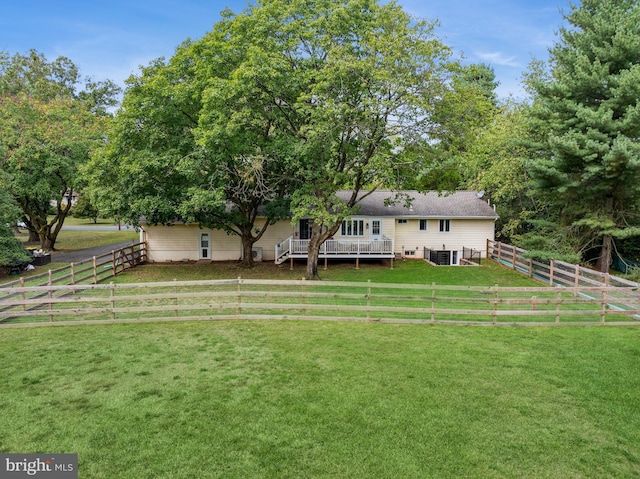 view of yard featuring a wooden deck and a rural view