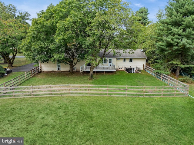 view of yard featuring central AC, a rural view, and a deck