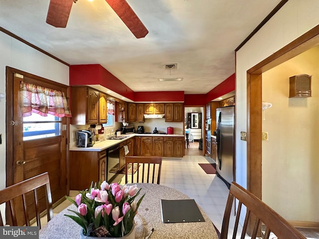 kitchen featuring stainless steel fridge, ornamental molding, ceiling fan, sink, and dishwasher