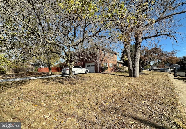 view of yard featuring a garage