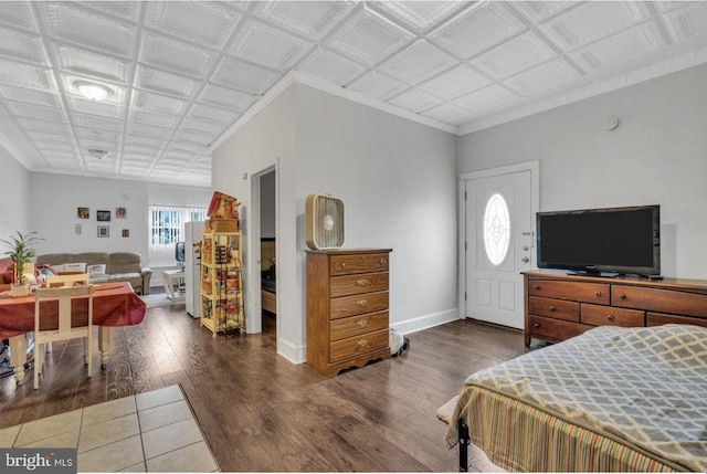 bedroom featuring dark hardwood / wood-style floors and ornamental molding