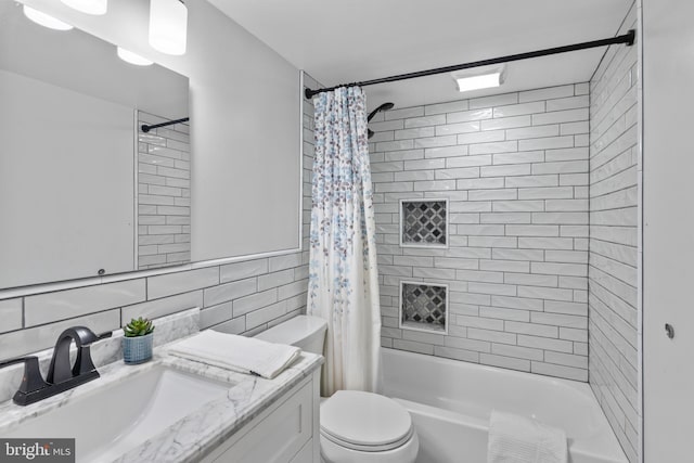 full bathroom with backsplash, shower / bath combination with curtain, toilet, vanity, and tile walls