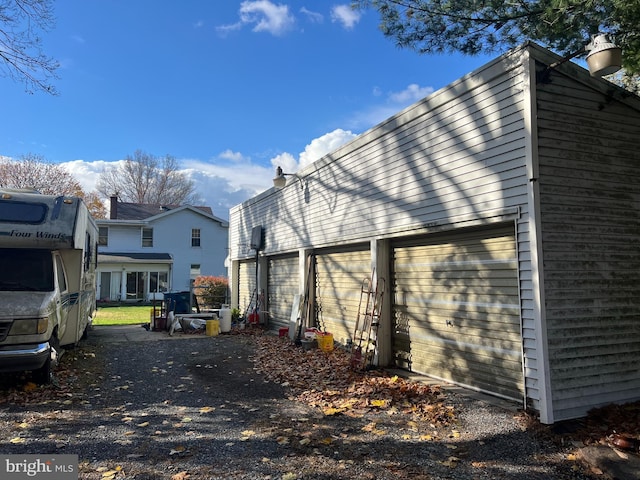 view of property exterior with a garage