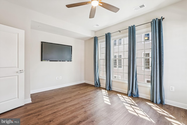 6832 General Davis NW, Washington, DC 20012 - unfurnished room with a ceiling fan, baseboards, and wood finished floors