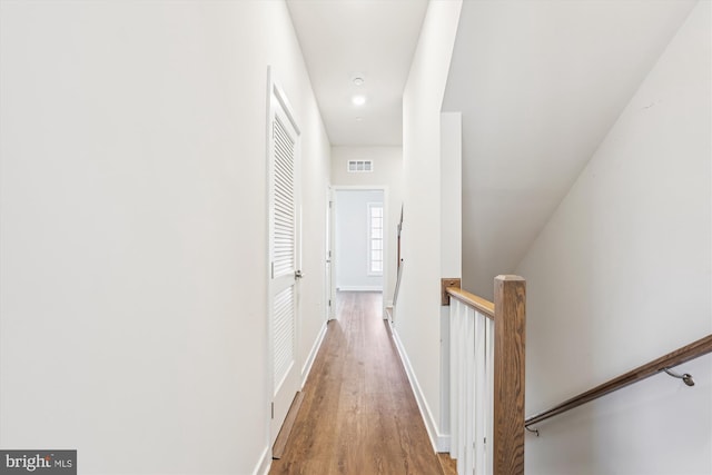 6832 General Davis NW, Washington, DC 20012 - corridor featuring an upstairs landing, wood finished floors, and baseboards