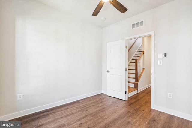 6832 General Davis NW, Washington, DC 20012 - empty room featuring ceiling fan, stairs, wood finished floors, and baseboards