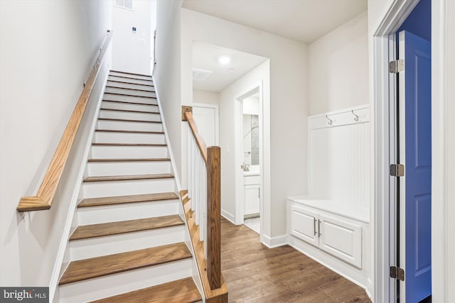 6832 General Davis NW, Washington, DC 20012 - staircase featuring wood finished floors