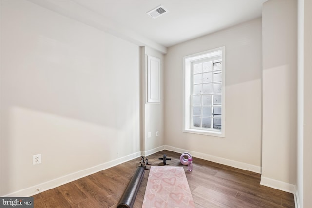 6832 General Davis NW, Washington, DC 20012 - workout room with baseboards and wood finished floors