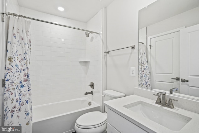 full bathroom with vanity, toilet, and shower / tub combo