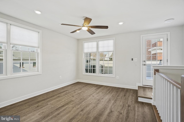 unfurnished room featuring hardwood / wood-style flooring and ceiling fan