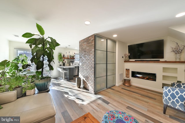 living room with light hardwood / wood-style floors