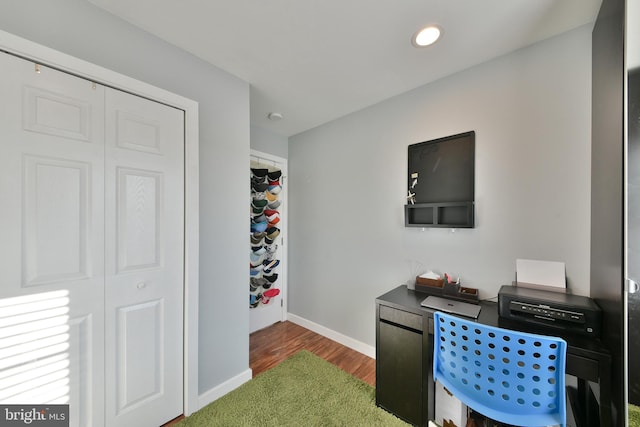 office space with dark hardwood / wood-style flooring