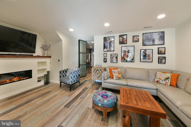 living room with light hardwood / wood-style floors