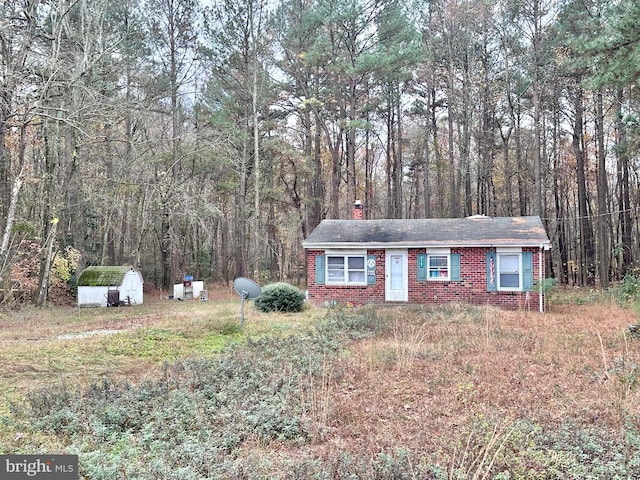 view of front facade featuring a shed