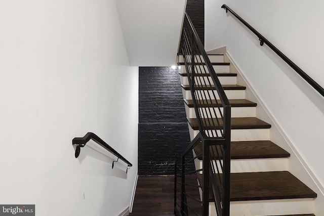 stairs featuring hardwood / wood-style flooring