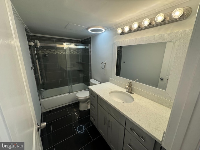 full bathroom with tile patterned flooring, vanity, toilet, and bath / shower combo with glass door