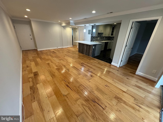 unfurnished living room with light hardwood / wood-style floors and ornamental molding