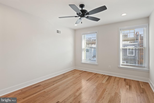 unfurnished room featuring light hardwood / wood-style floors and ceiling fan