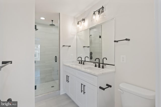 bathroom with an enclosed shower, vanity, toilet, and tile patterned flooring