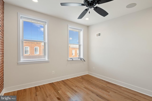 unfurnished room with ceiling fan and light hardwood / wood-style flooring