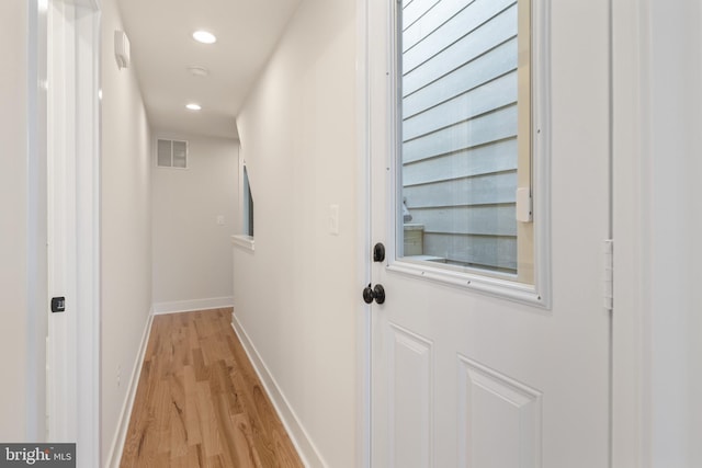 hall with light hardwood / wood-style flooring