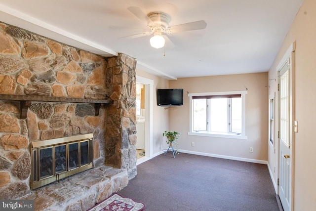 unfurnished living room featuring a fireplace, ceiling fan, and carpet