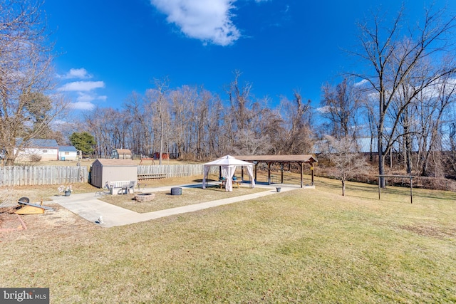 view of yard featuring a gazebo and a shed