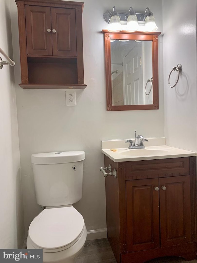 bathroom with toilet and vanity