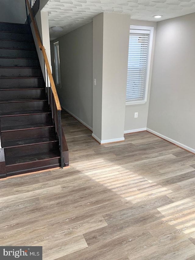 interior space with hardwood / wood-style flooring and a textured ceiling