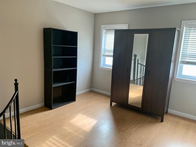 unfurnished bedroom with light wood-type flooring