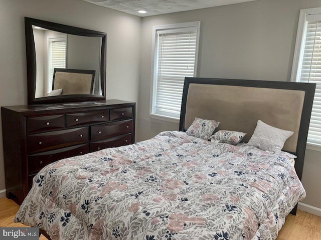 bedroom featuring light wood-type flooring