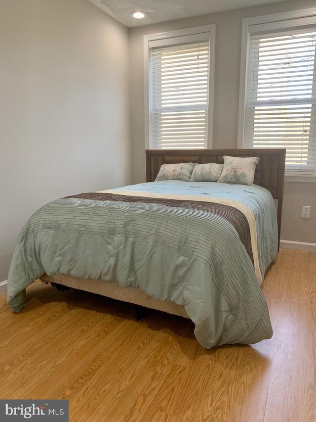 bedroom featuring wood-type flooring