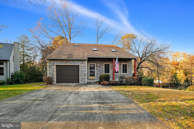 view of front facade with a garage and a front lawn